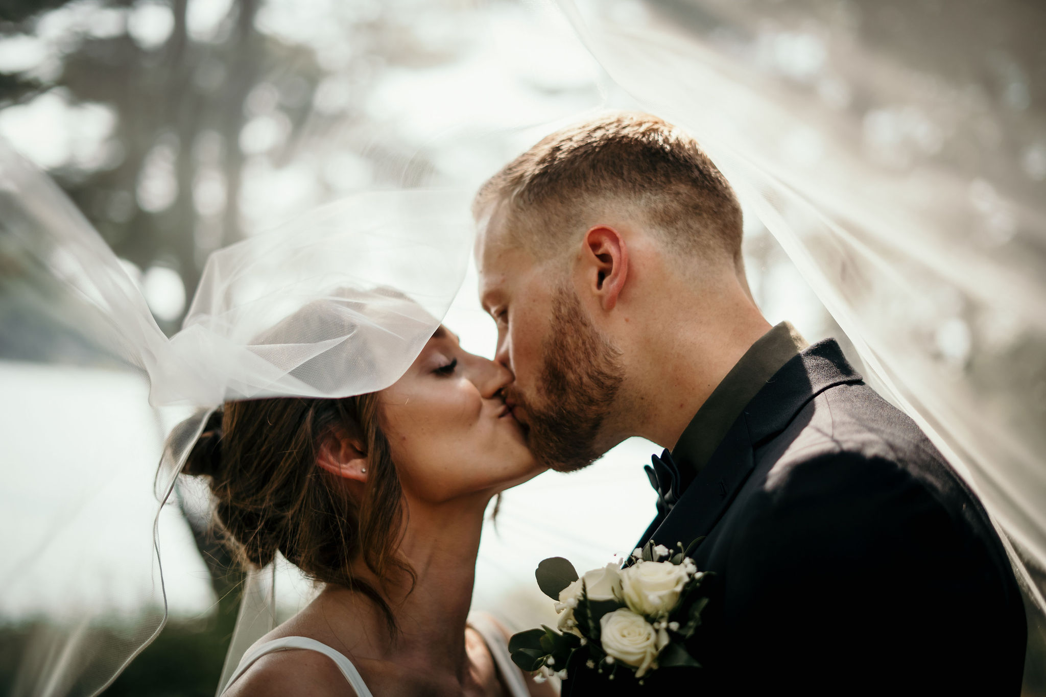 Romantic wedding kiss at sunset in Milwaukee