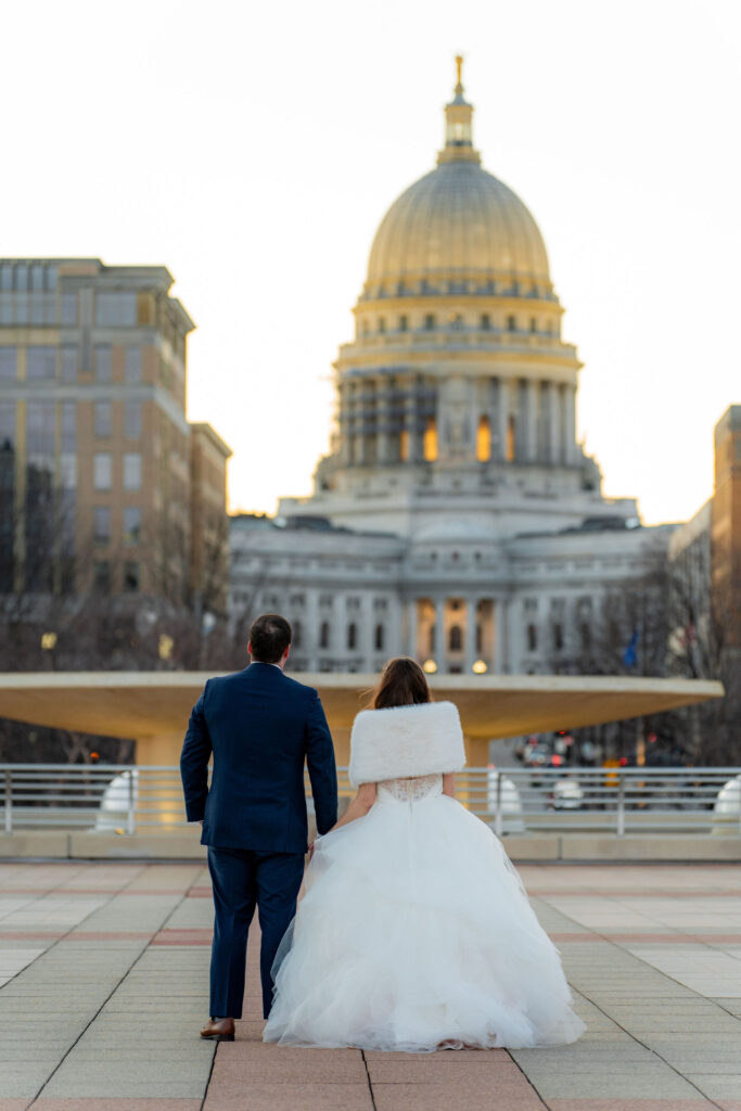 Newlyweds posing at sunset in Green Bay, WI.