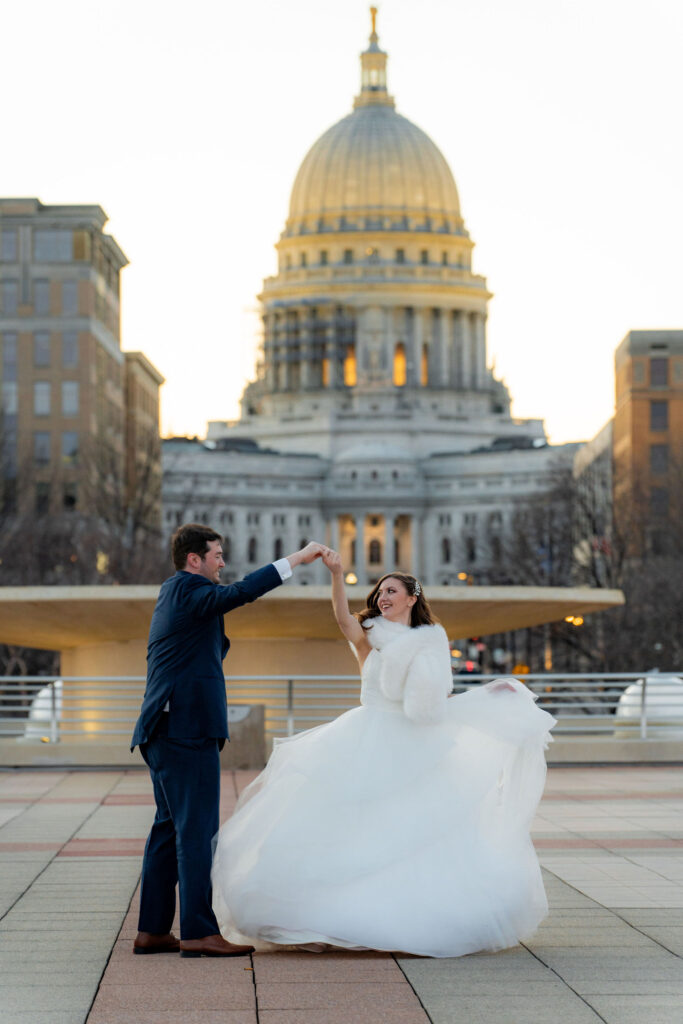 Newlyweds posing at sunset in Green Bay, WI.