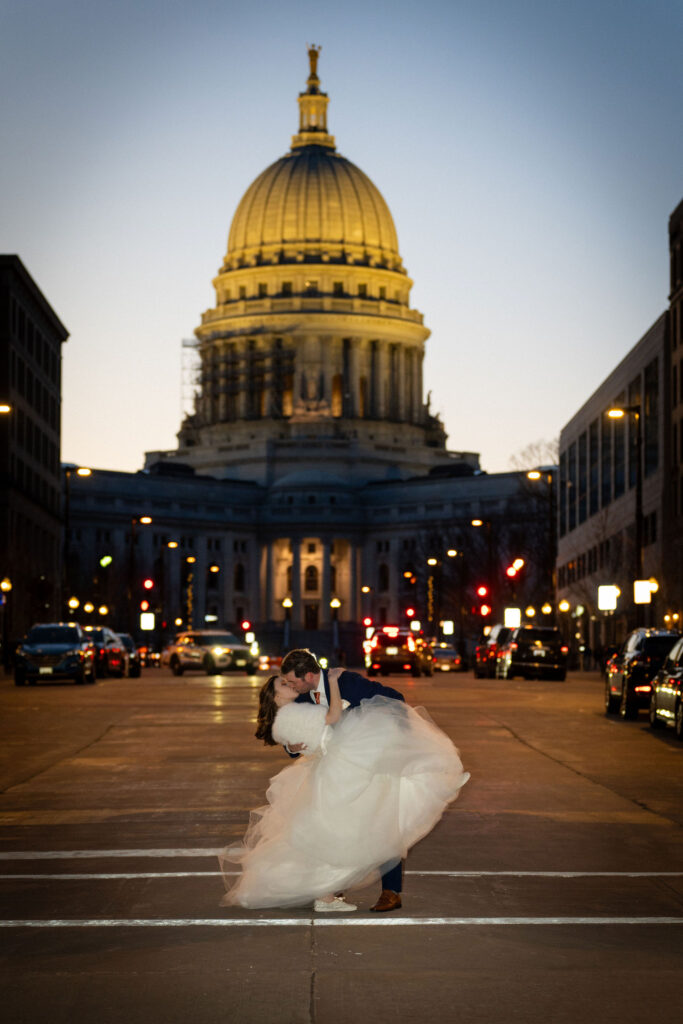 Newlyweds posing at sunset in Green Bay, WI.