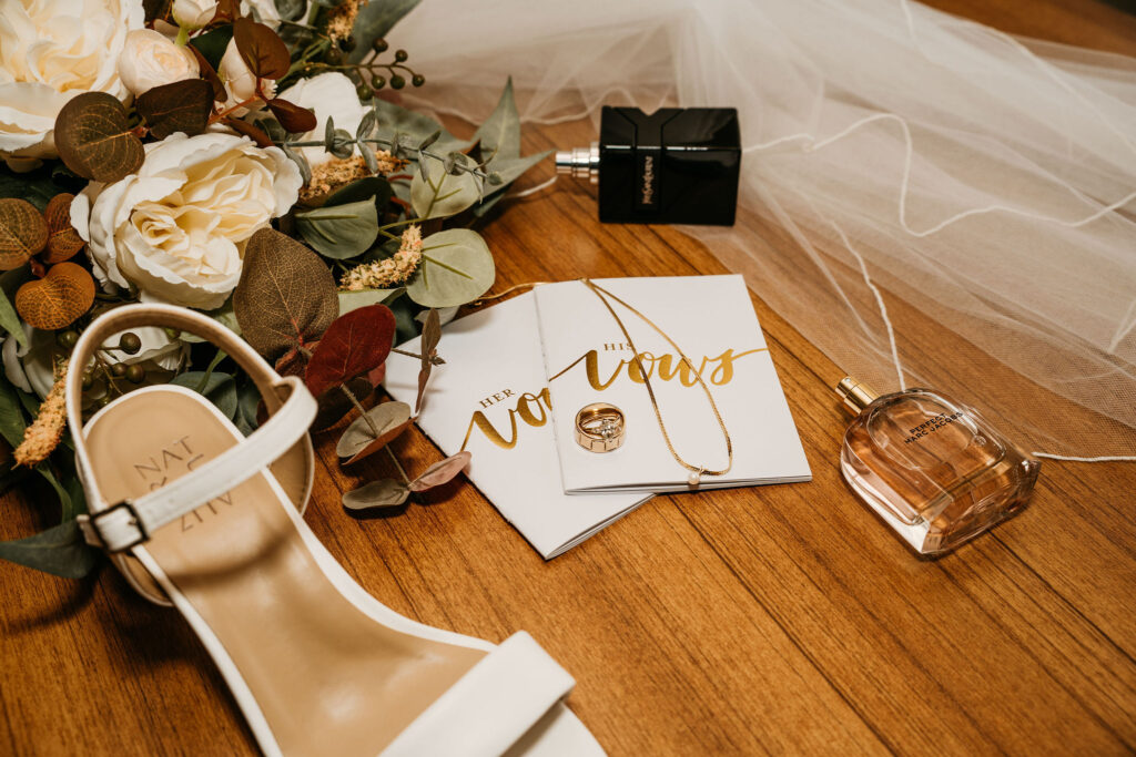 Close-up of wedding rings on invitation card