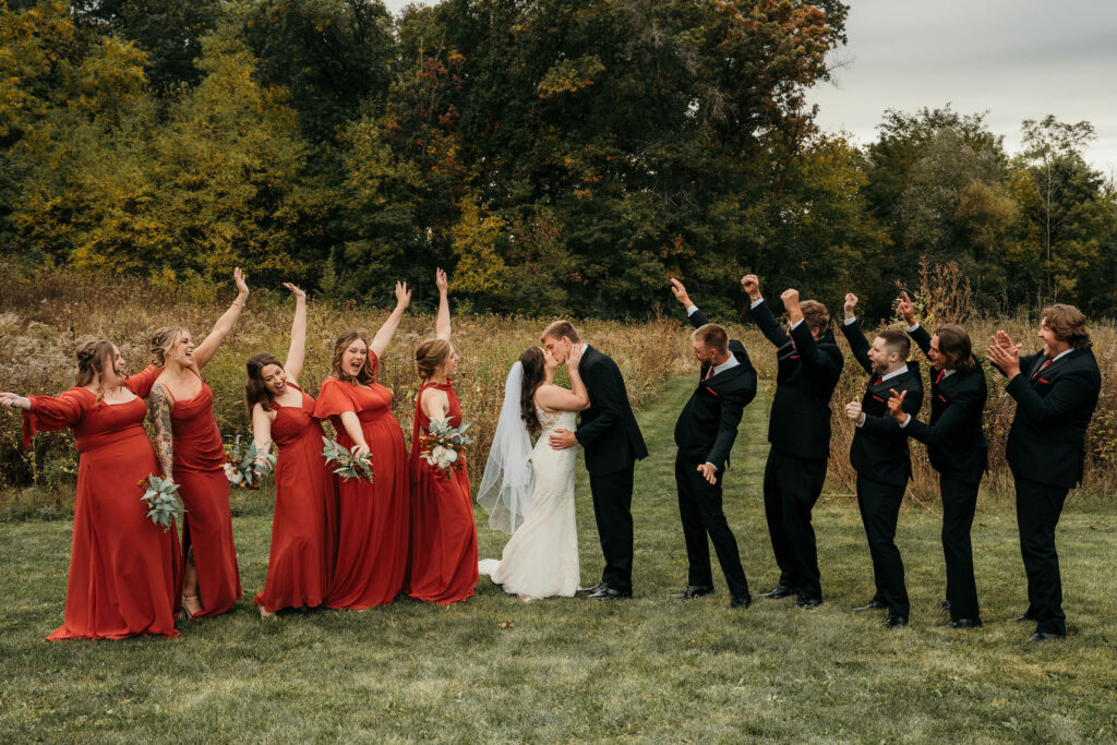 Bridal party celebrating with the bride and groom