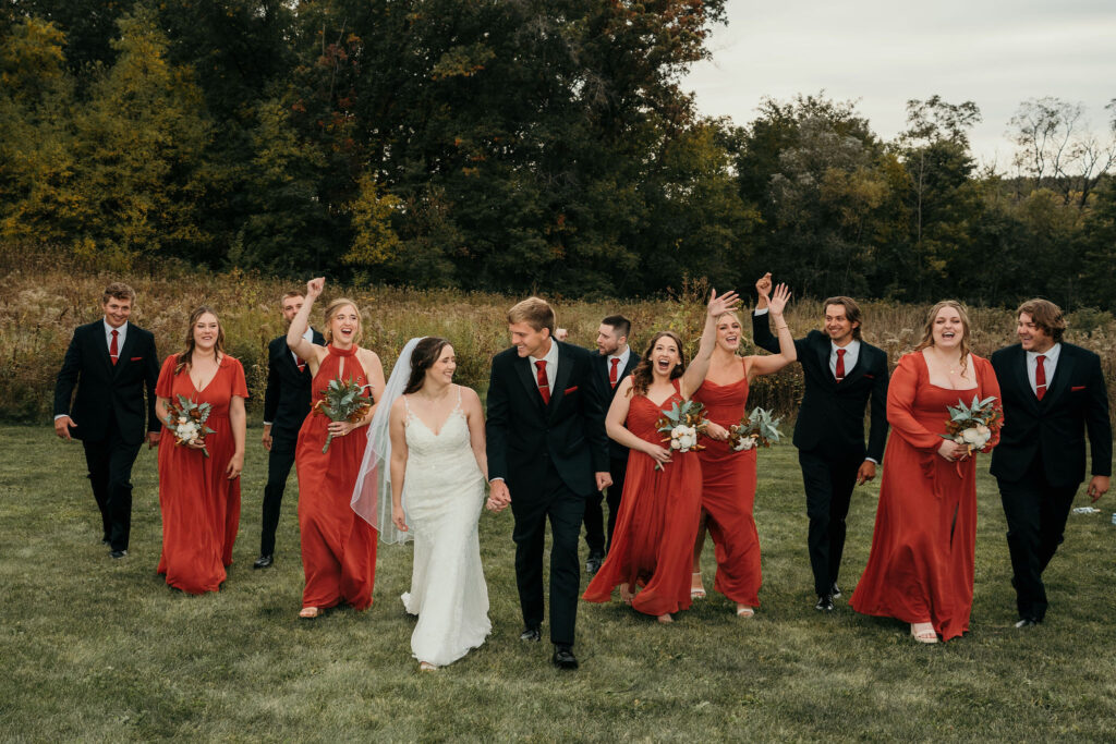 Bridal party celebrating with the bride and groom