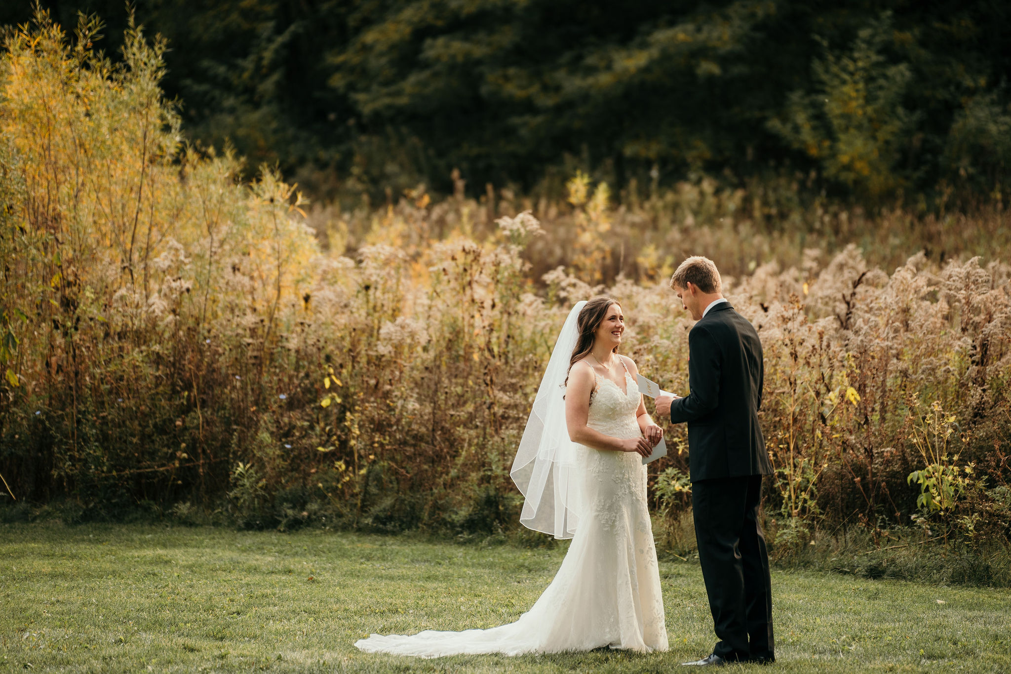 Groom holding a handwritten vow